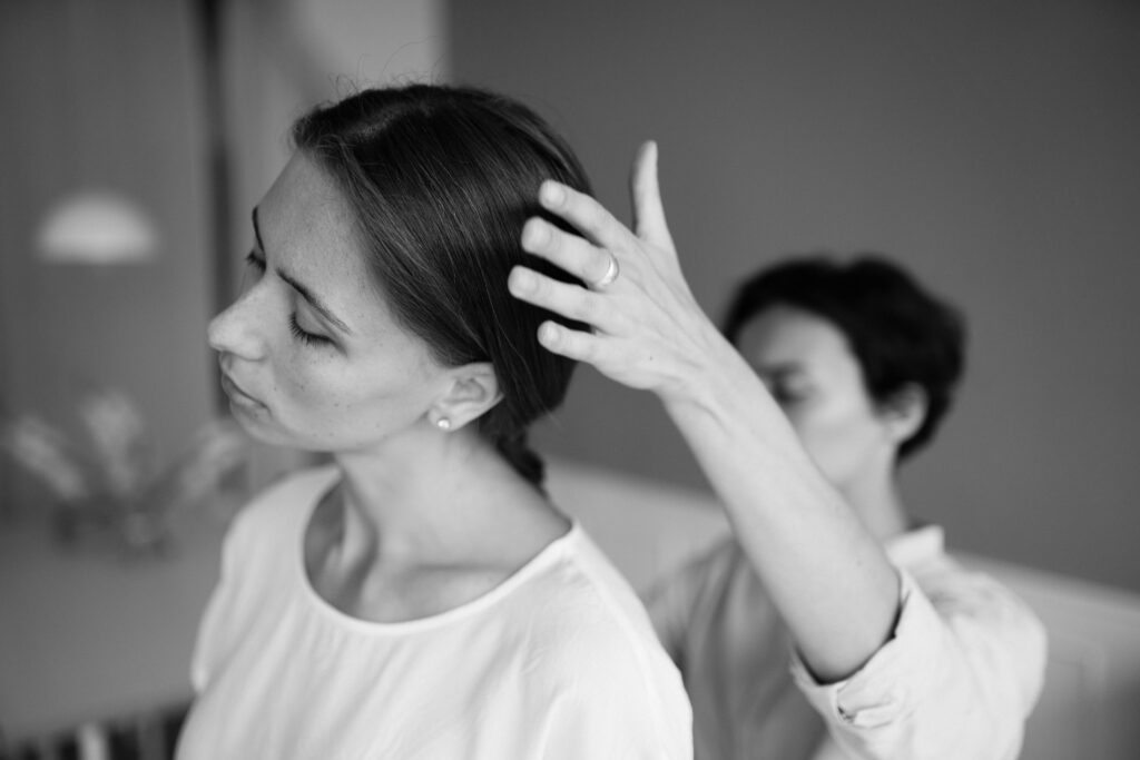 A serene black and white portrait capturing a therapy session indoors.